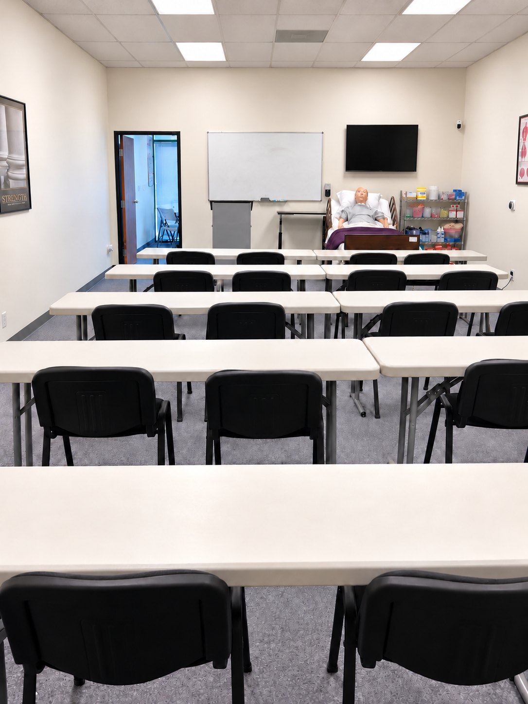 Bell’s classroom with tables, chairs, and training space